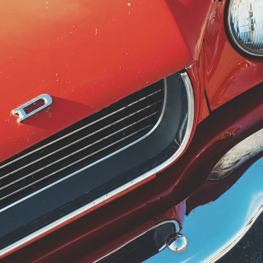 Red car grille closeup carlisle pa at Heritage Collision & Auto Body in Carlisle, PA